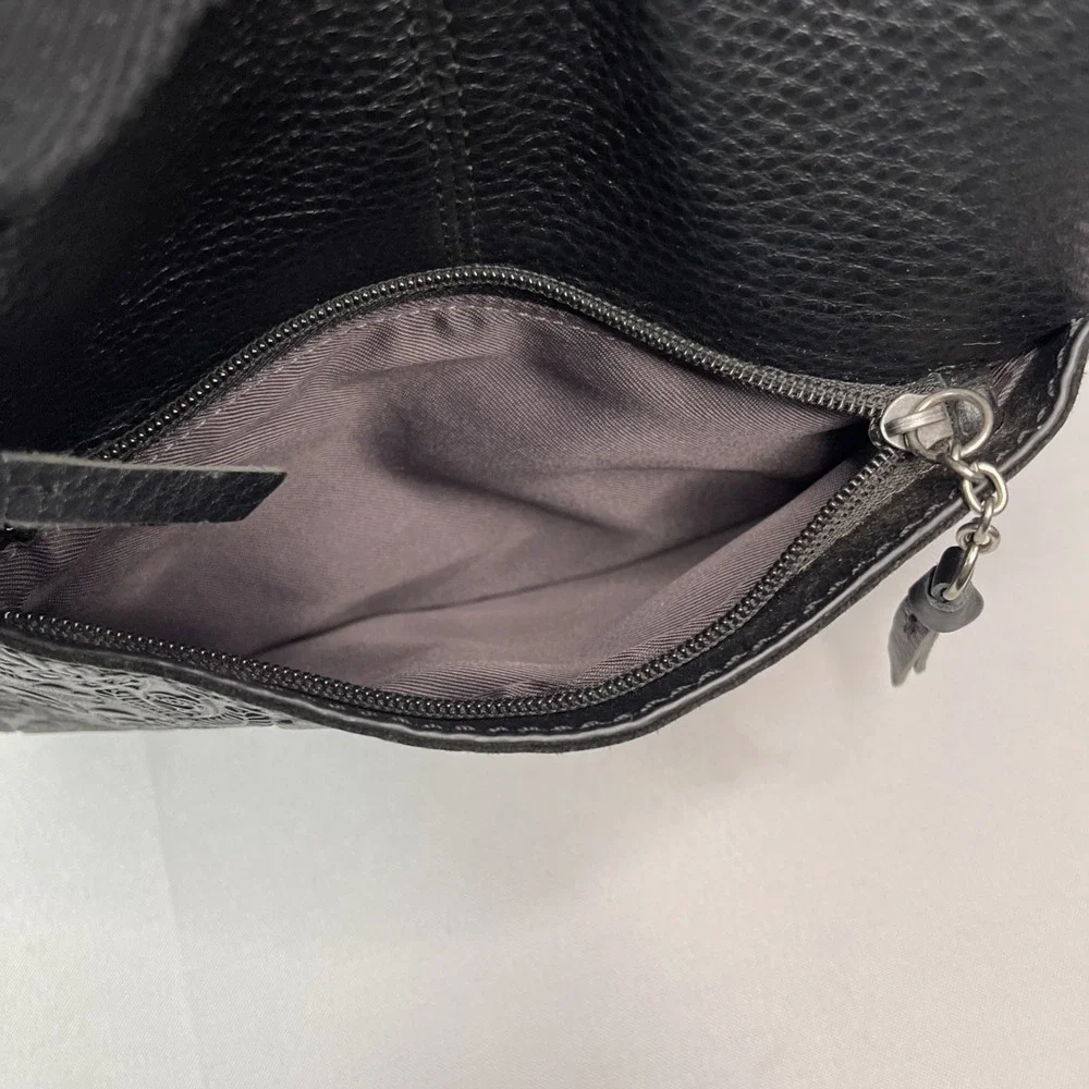The Sak Crossbody Black Genuine‎ Leather Tooled Embossed Purse Tassels